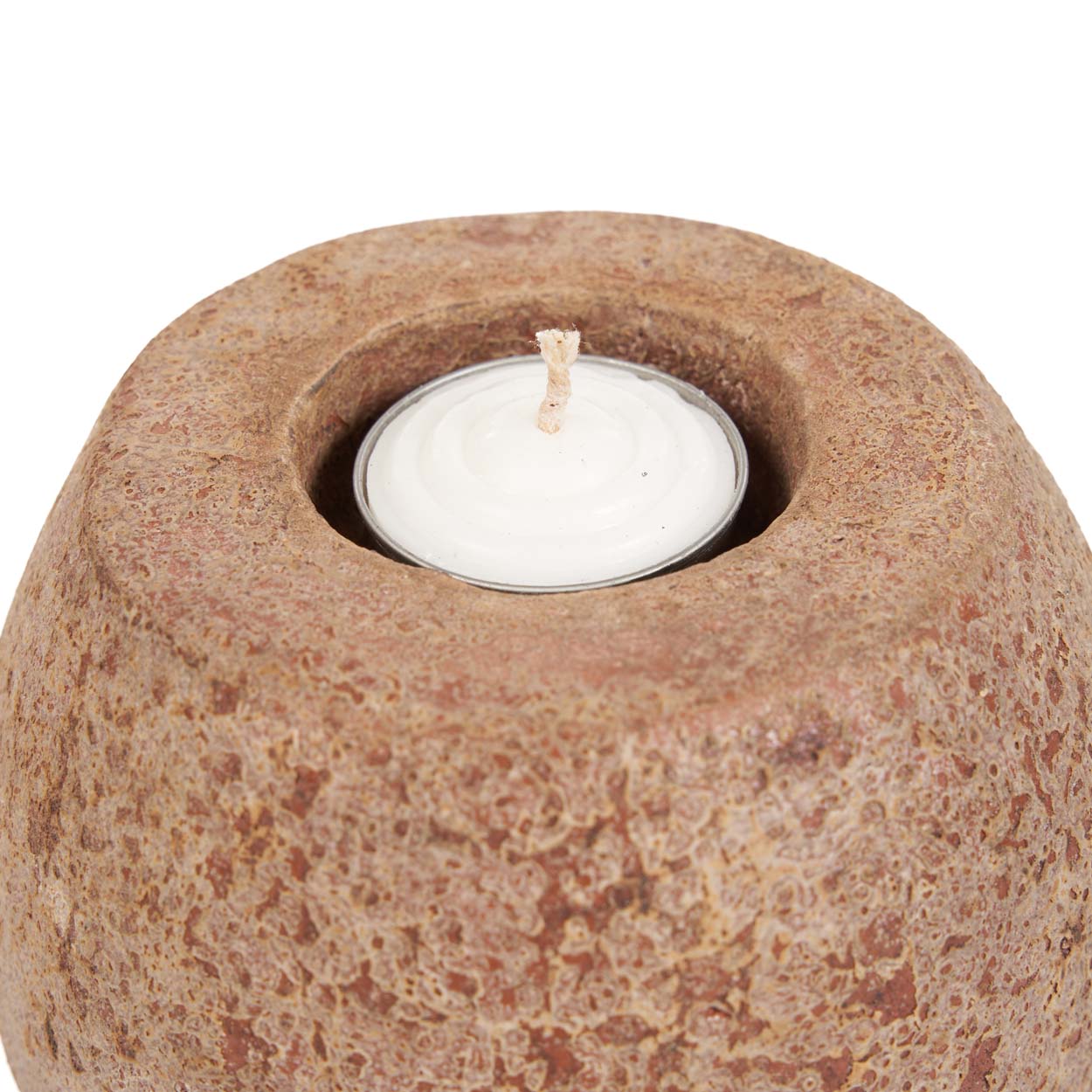 Candle holder with a white candle on a white background