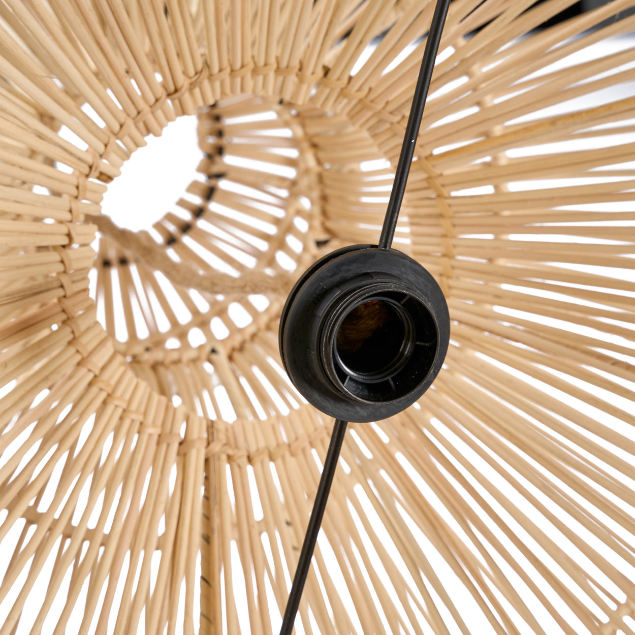 Close-up of a rattan lampshade of The Matcha Whisk Pendant - Natural on a white background