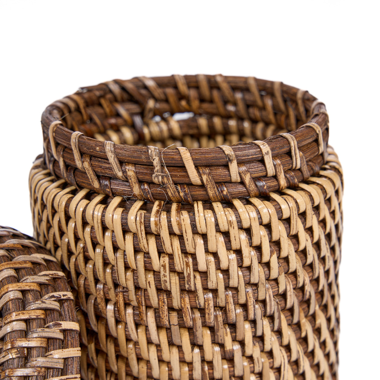 Close-up view of woven basket on a white background