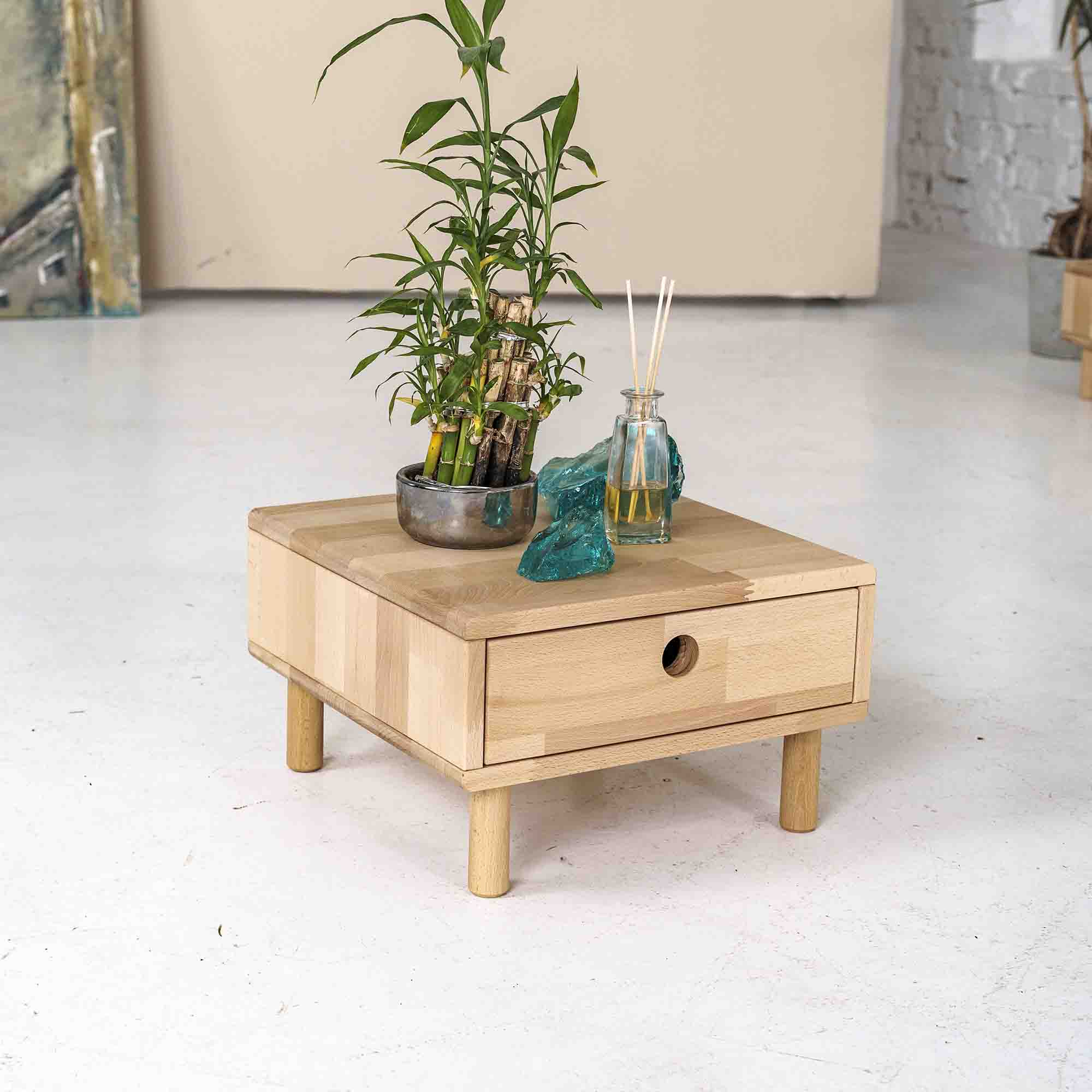 Small wooden bedside table with drawer