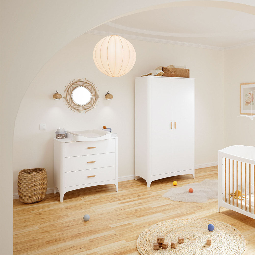 Nursery room with NEREE Wardrobe 2D on a wooden floor.