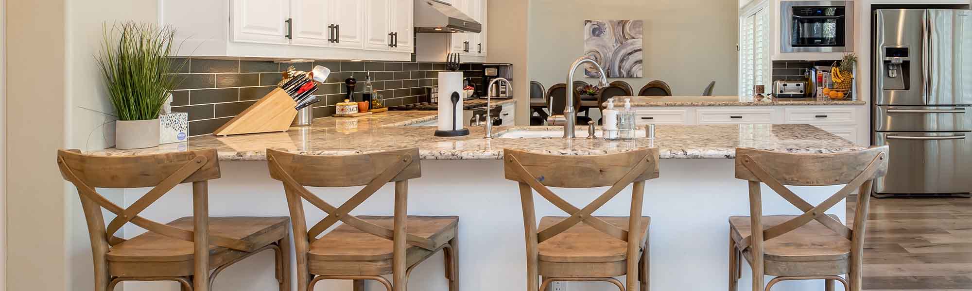 Kitchen accessories on the background of a bar counter with elegant bar stools