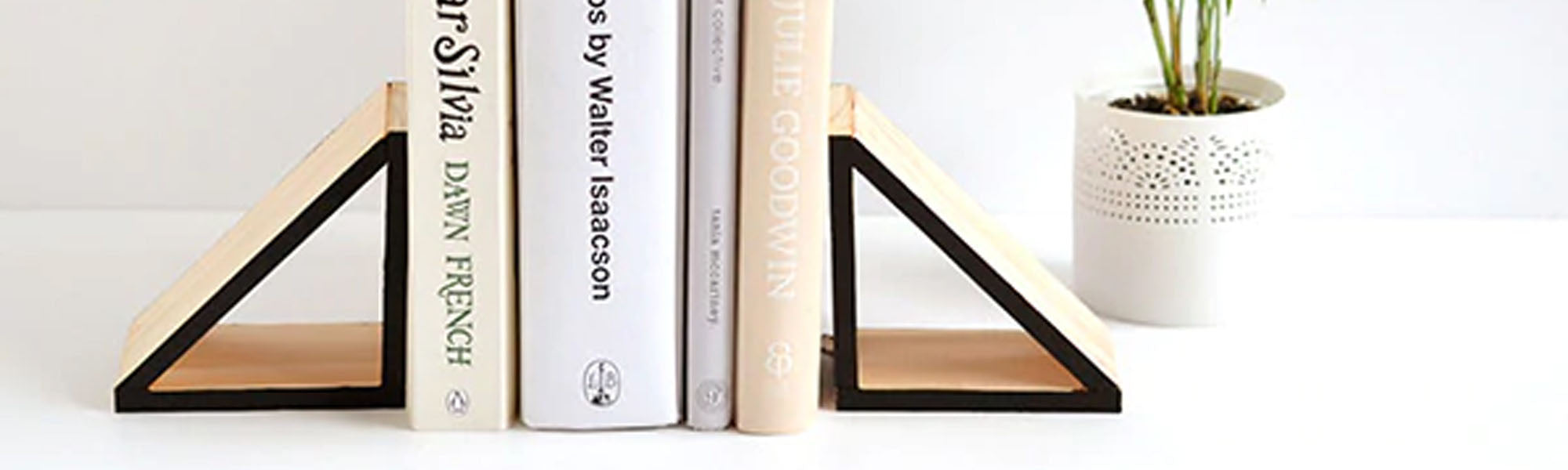 Beautiful wooden triangular bookends with books inside