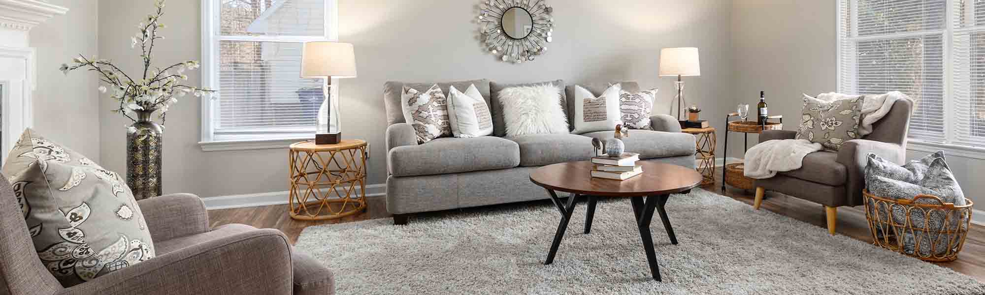 Stylish furniture: a sofa, an armchair and a table in the living room with a wonderful design