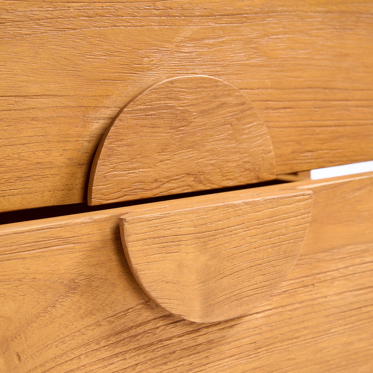 Close-up of a wooden semi-circular handle.
