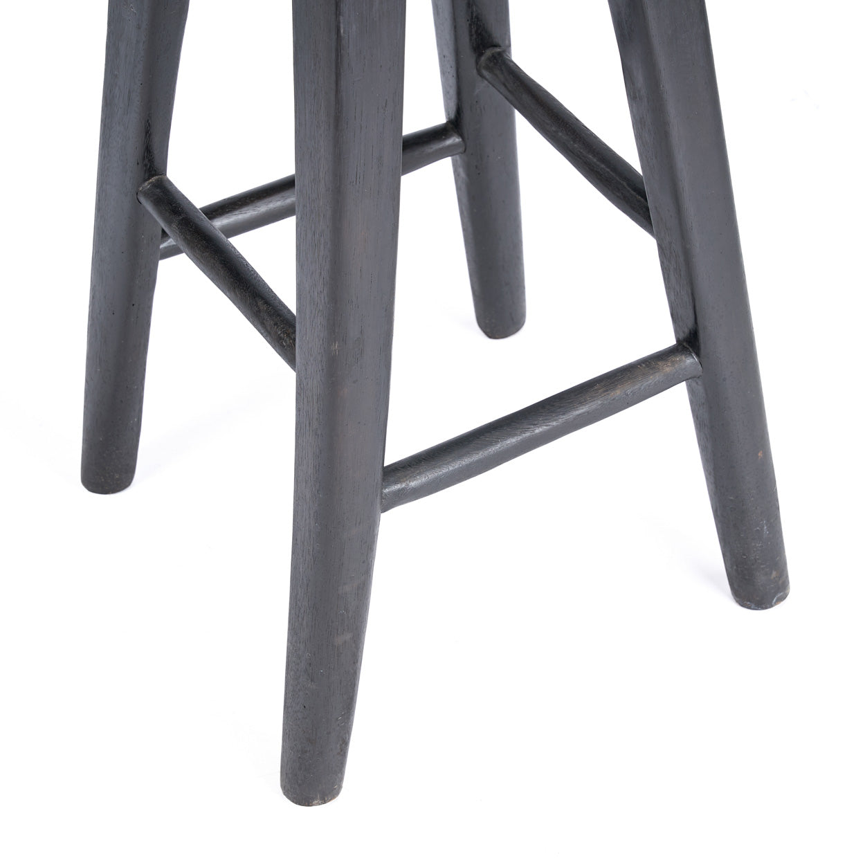 Close-up of a black bar stool on a white background