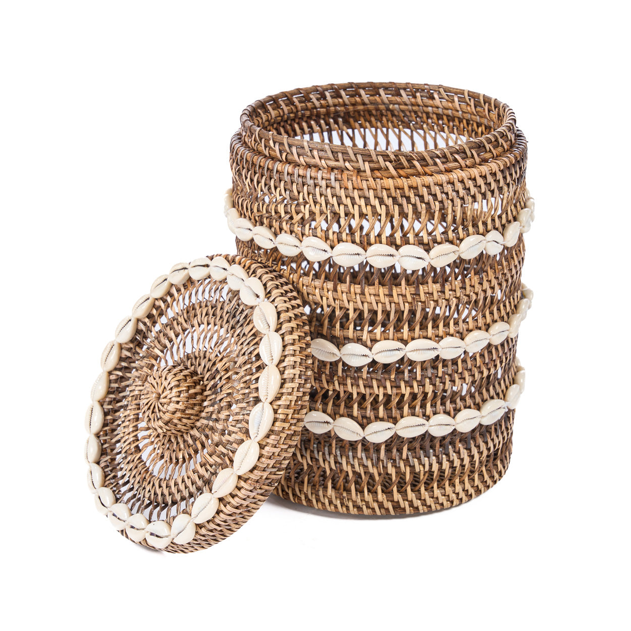 Woven rattan basket with decorations on a white background
