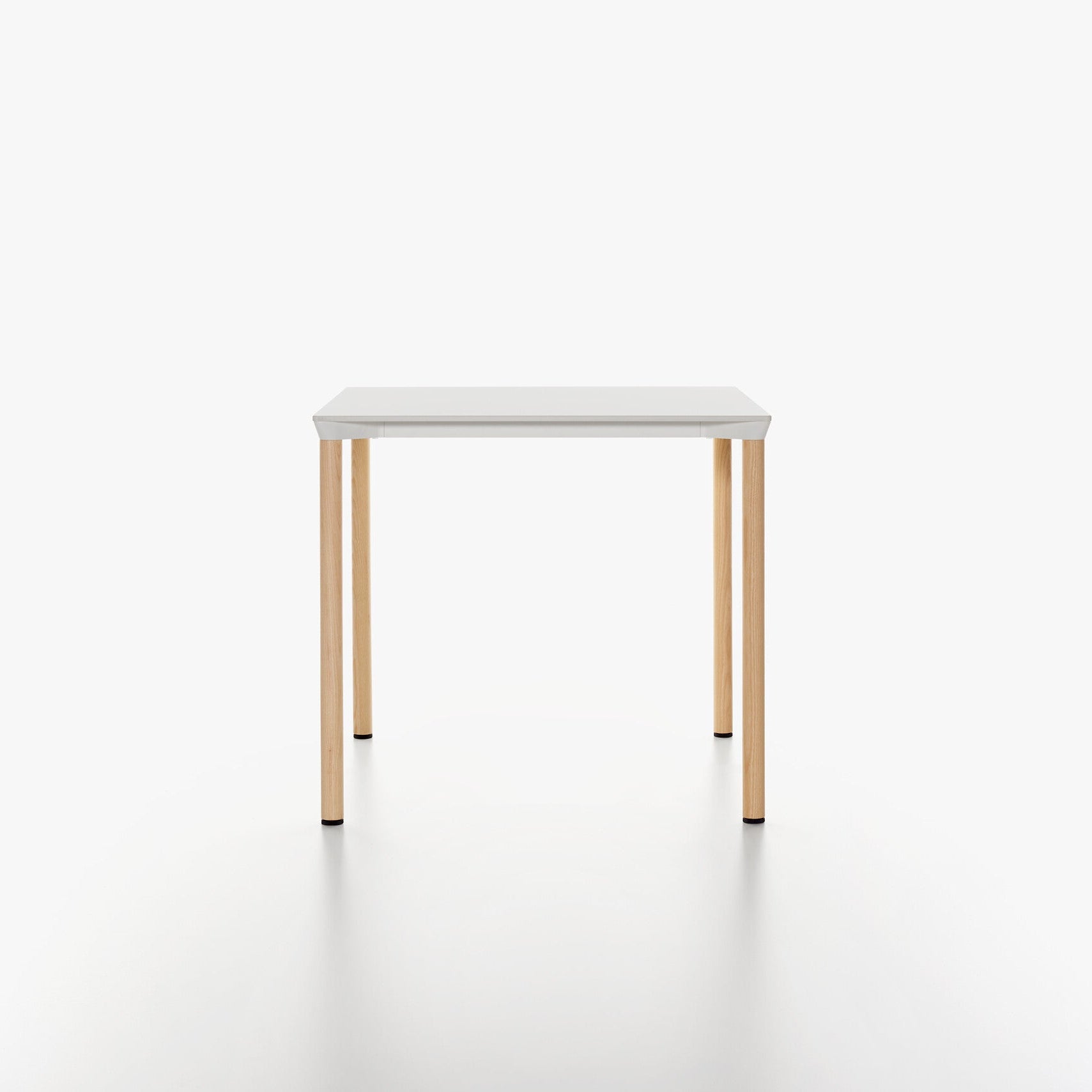 MONZA square table with white HPL table top and ash natural lacquered legs on a white background