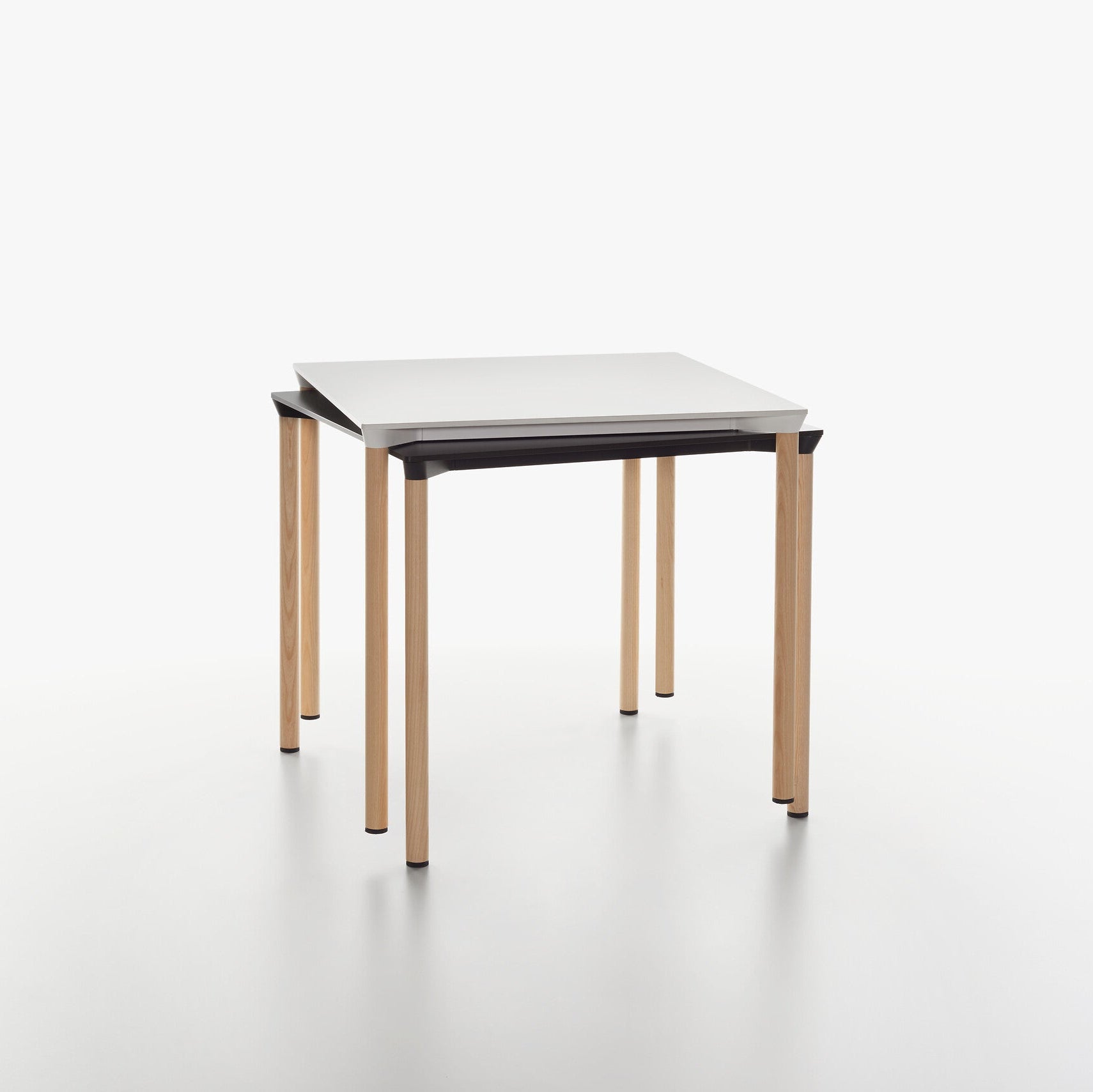 MONZA square tables with black and white HPL table tops and ash natural legs on a white background