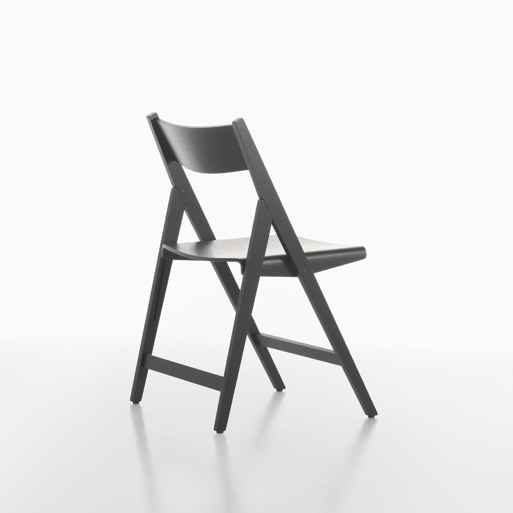 Back view of black THEO folding chair on a white background