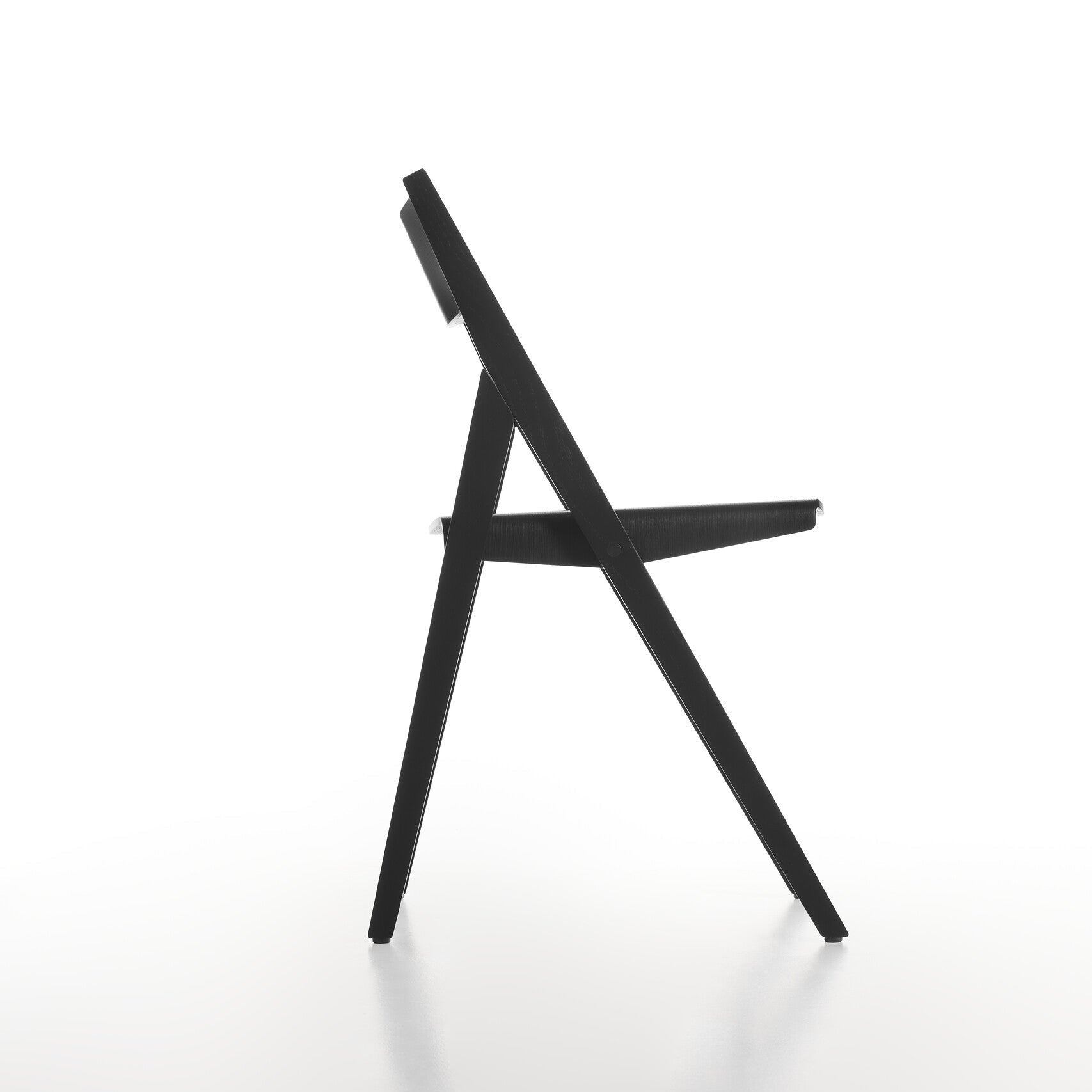 Side view of black THEO folding chair on a white background