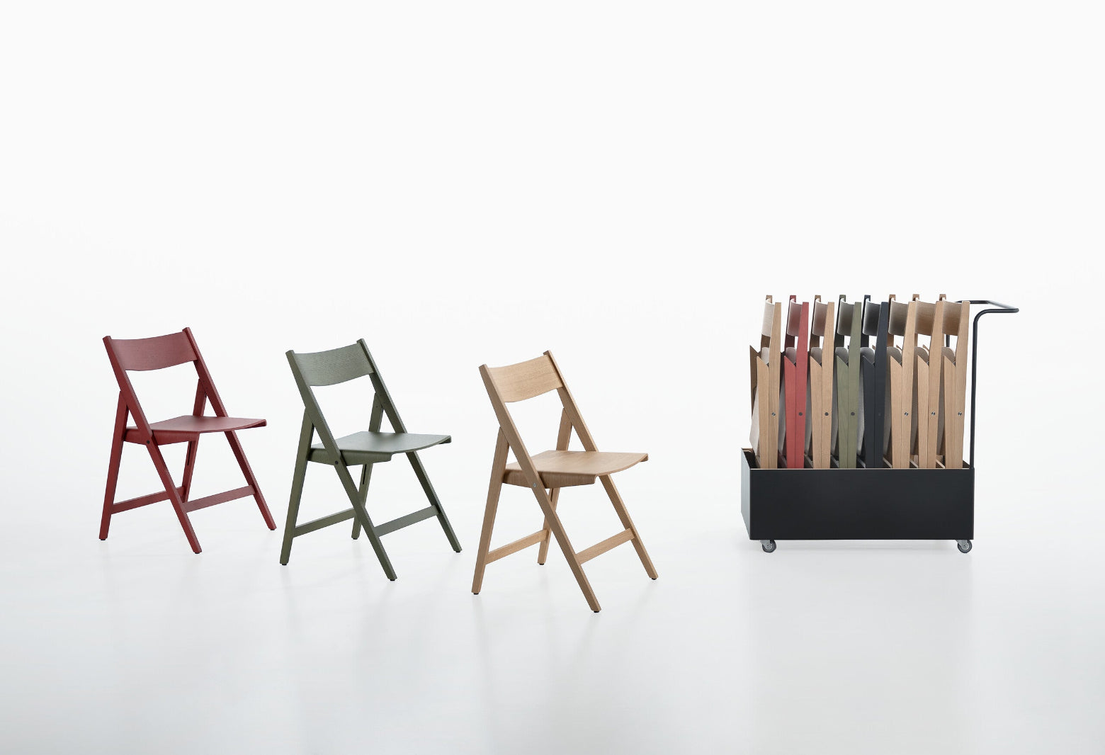 Set of THEO folding chairs in various colors with a trolley holding chairs on a white background