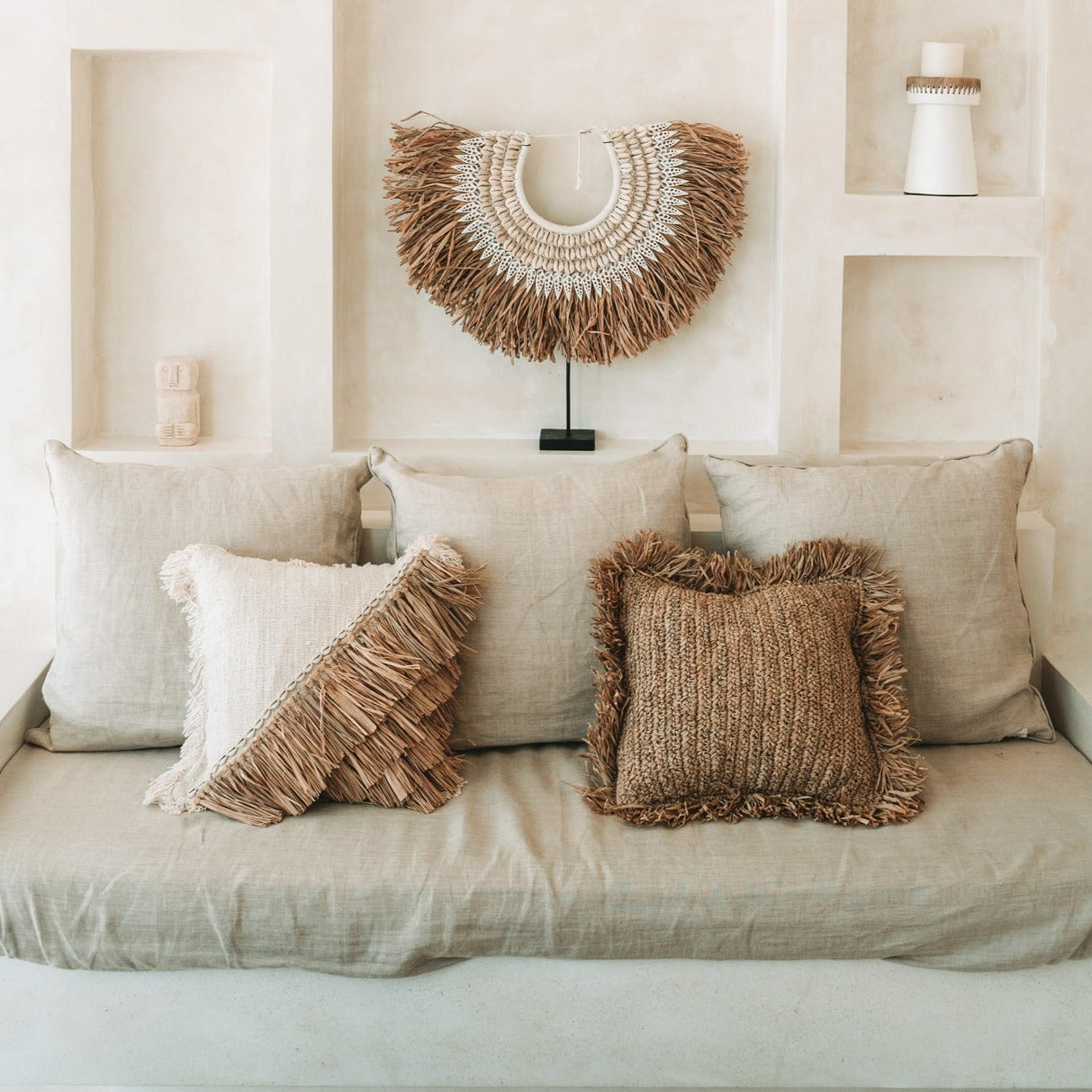 THE RAFFIA COTTON Cushion Cover interior view on couch