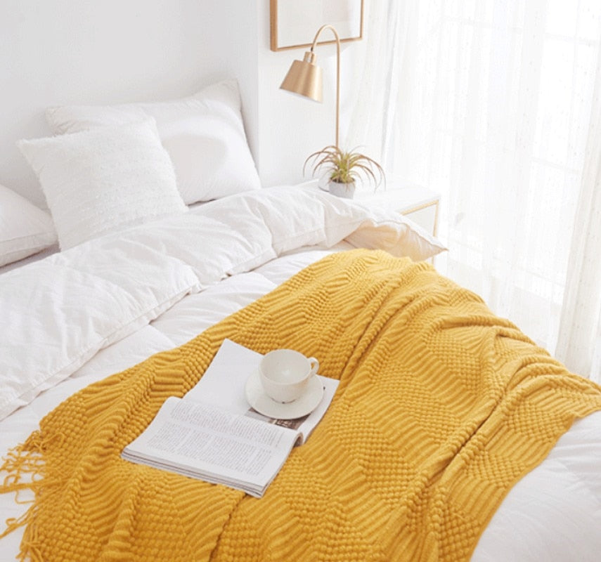 Decorative Knitted Blanket with Tassels yellow  at the bed